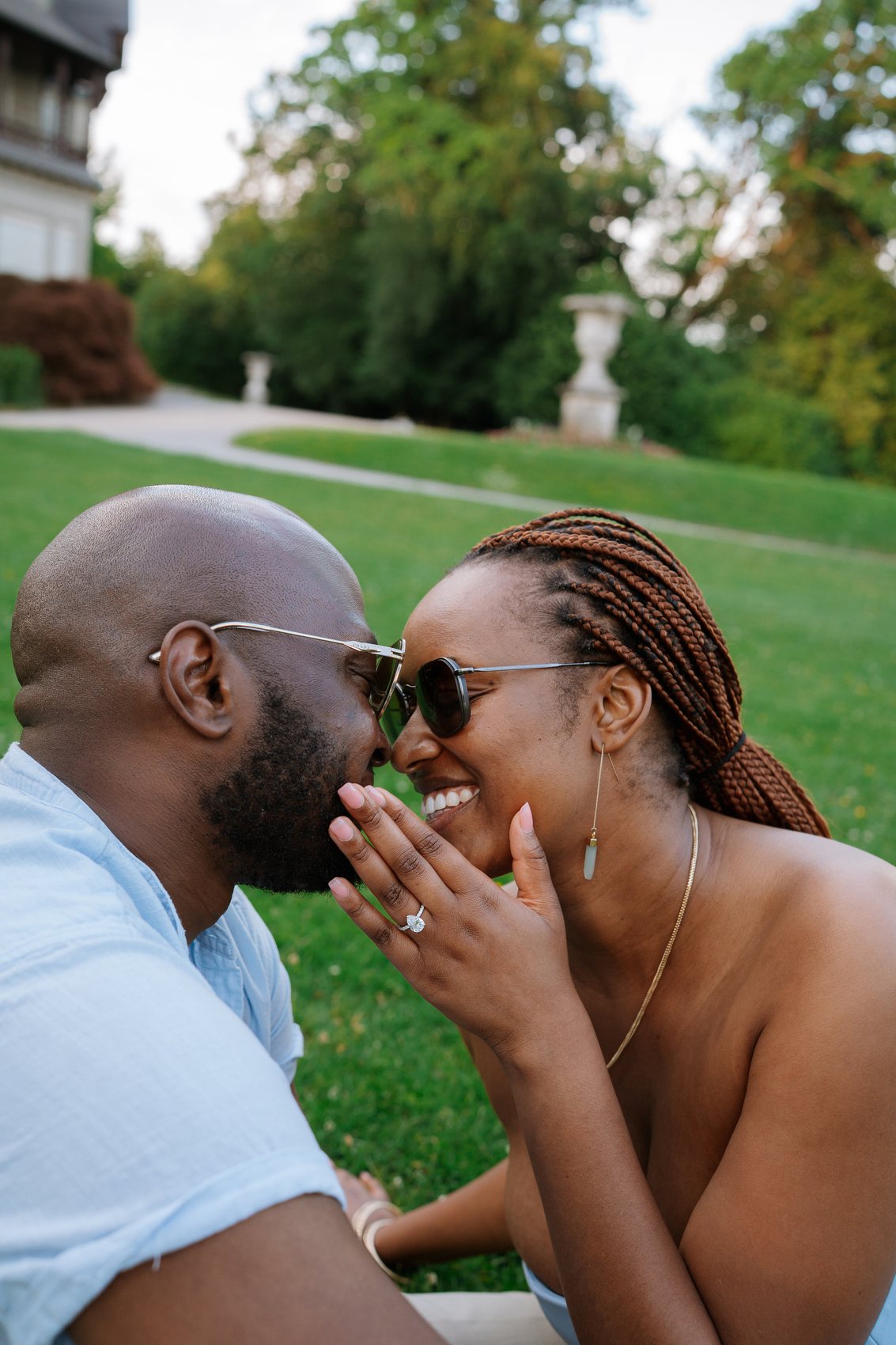 The couple forehead to forehead in the golden evening light