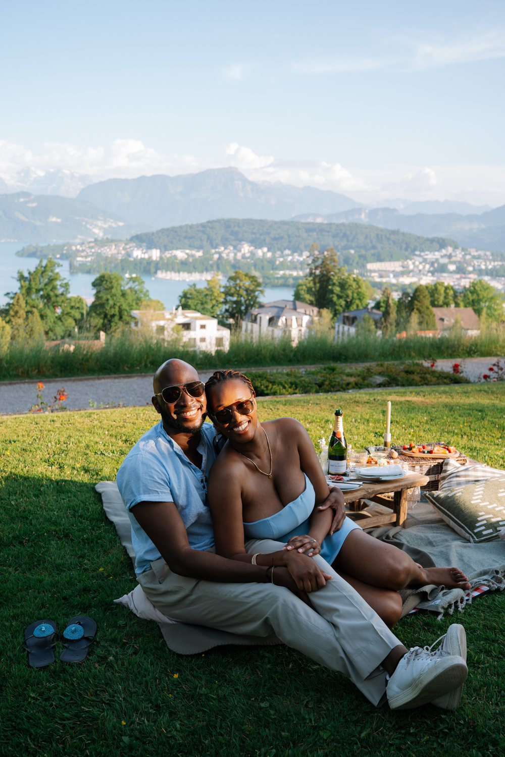 Adetunji and Sally embracing by Lake Lucerne